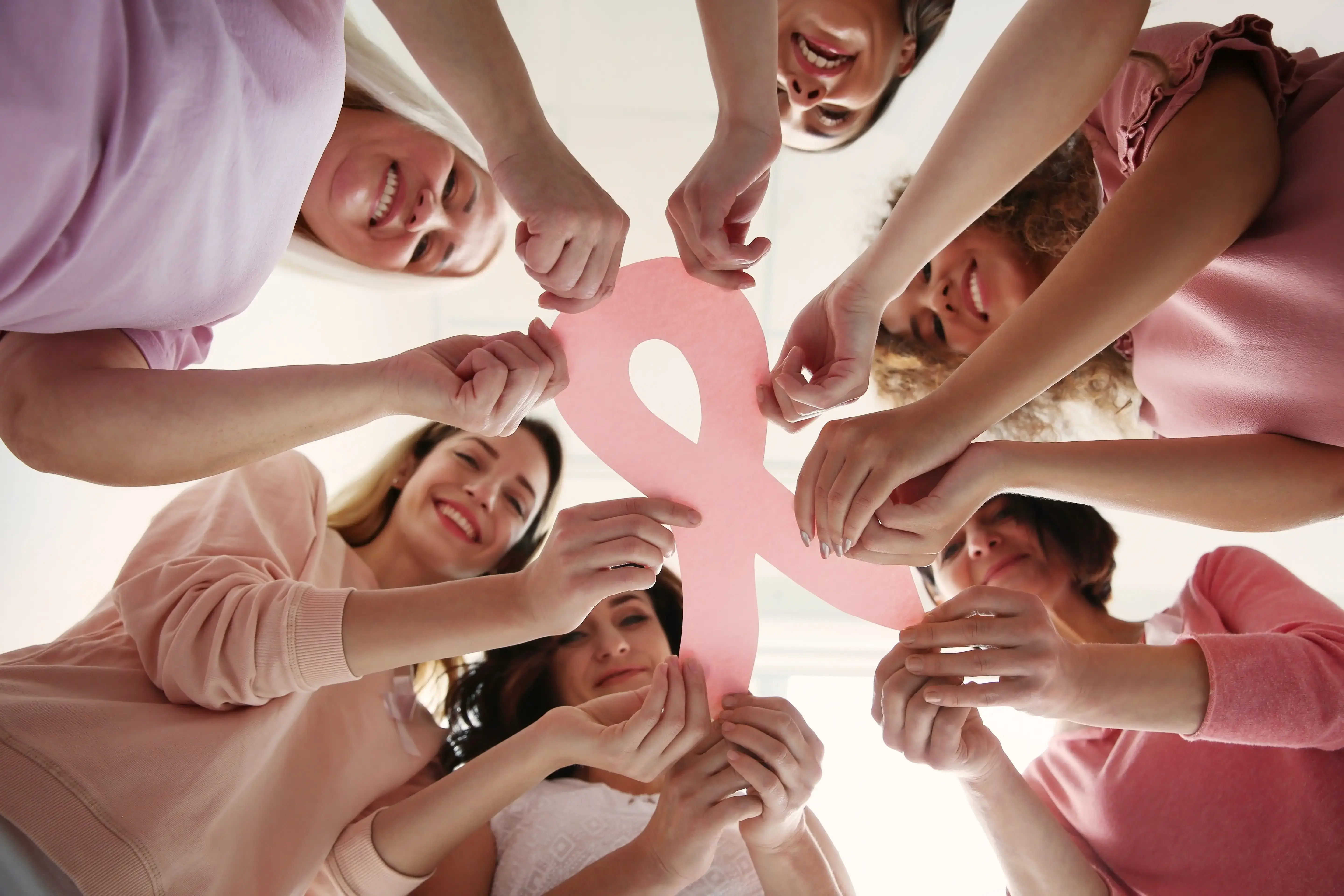 Woman learning about early breast cancer symptoms and breast health awareness