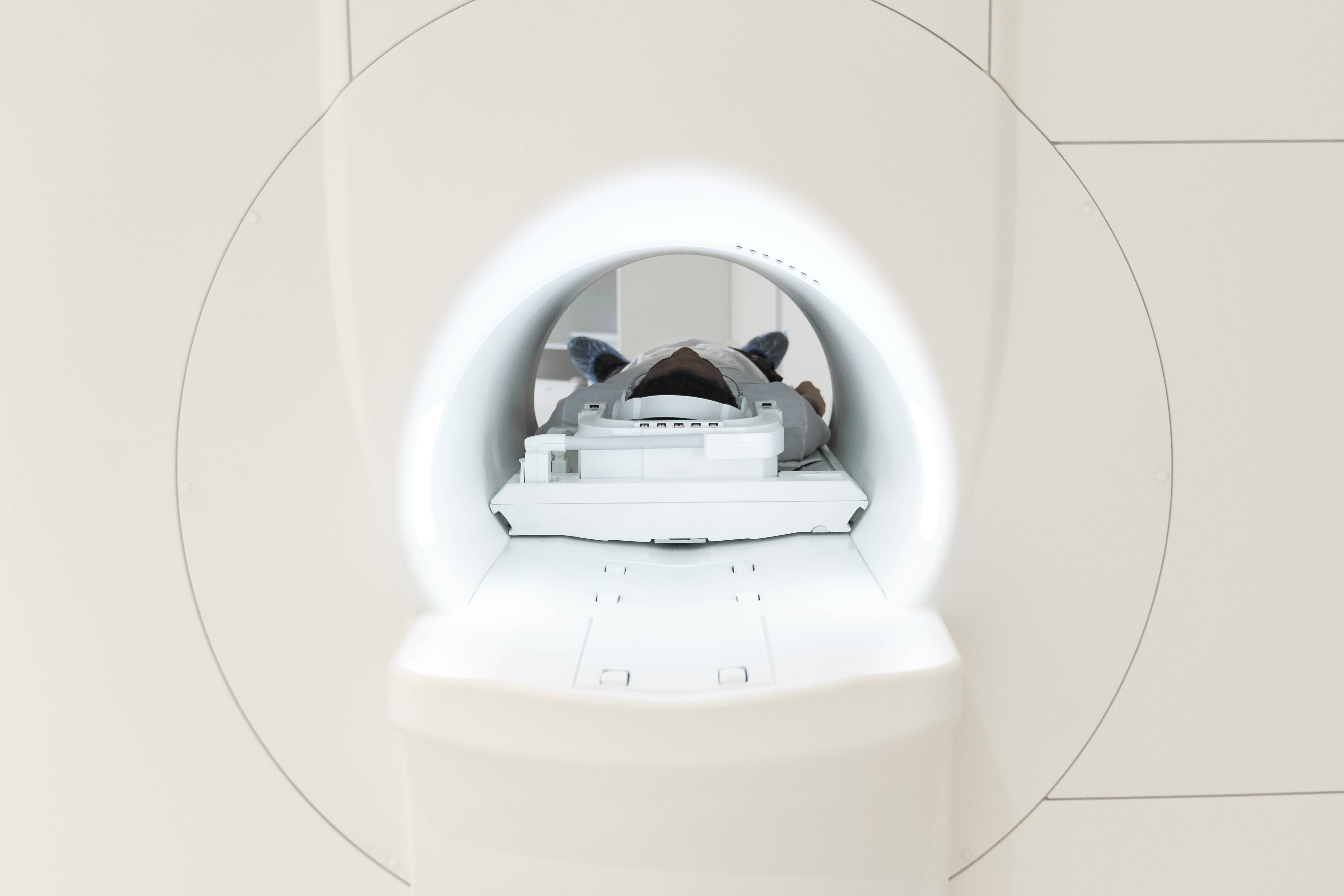 Patient undergoing a PET CT scan in a hospital imaging room