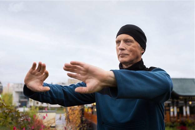 Cancer survivor practicing yoga